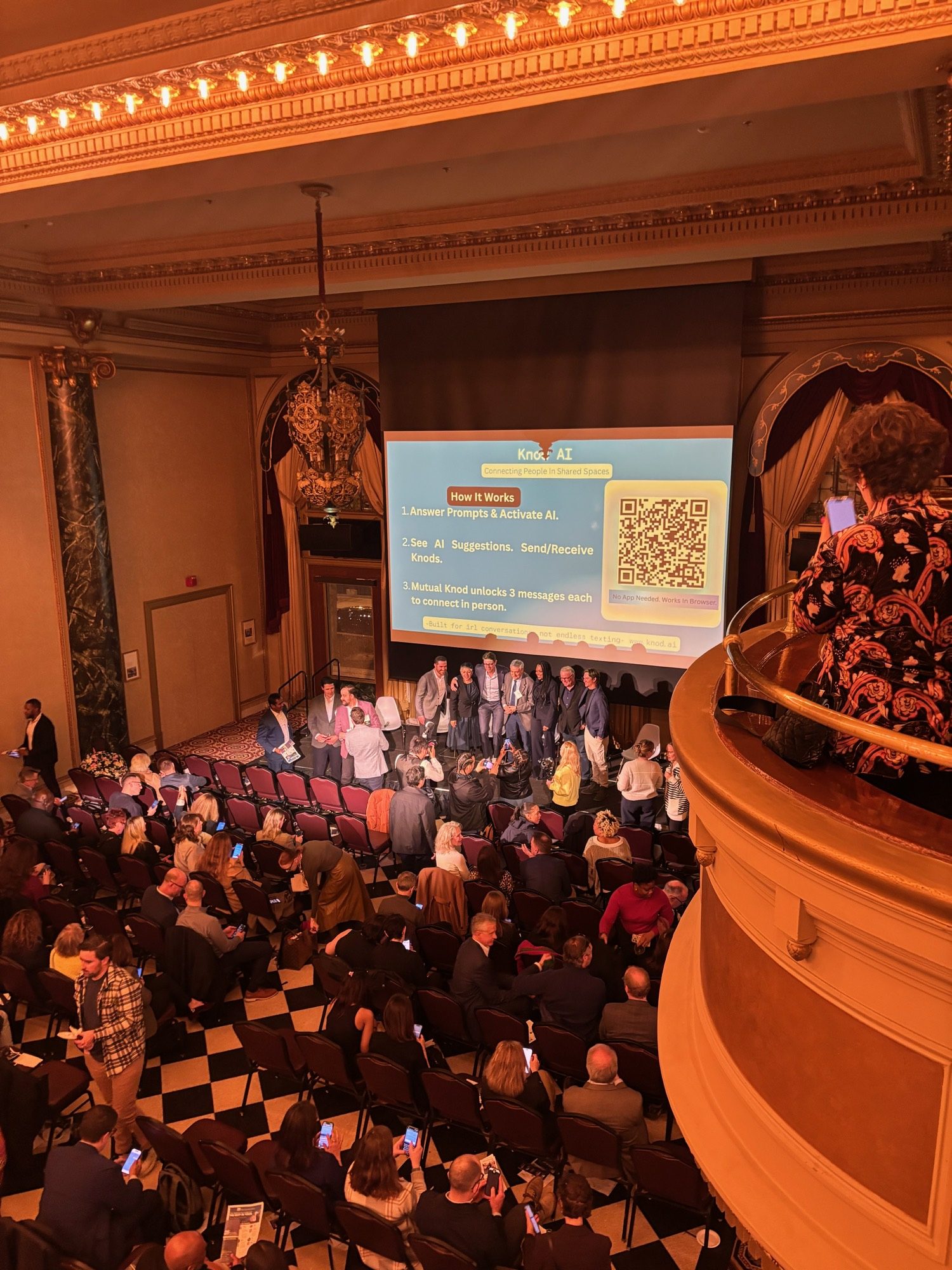 A full ballroom of Chicago Innovation attendees seen from the balcony