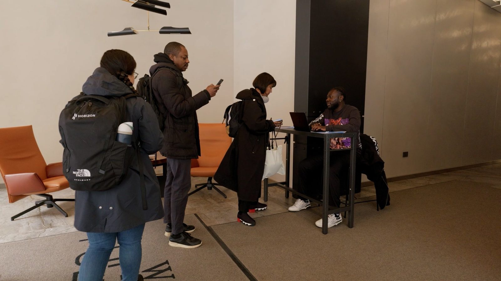 Attendees checking in at the Vibecoding Hackathon at Drive Capital